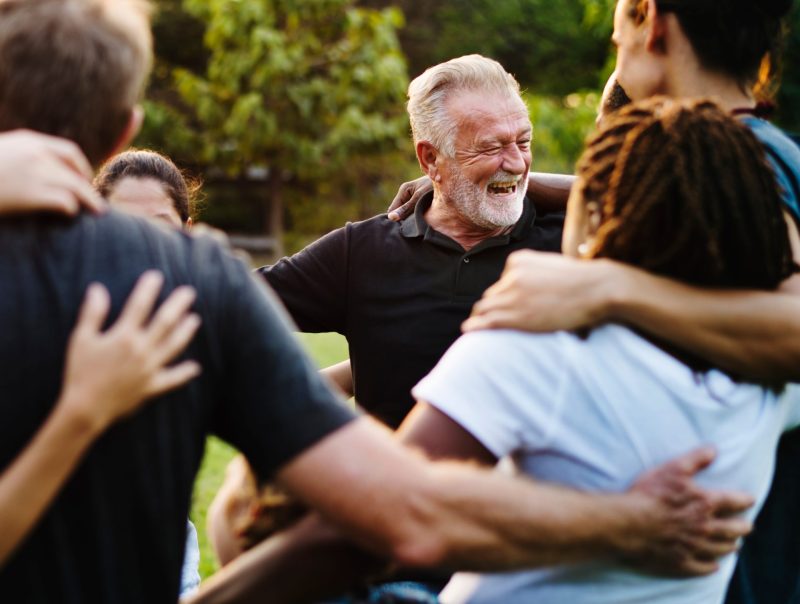 Group of people hugging Group of people hugging